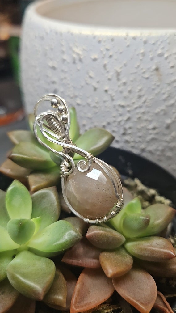 Stunning Sterling Silver wrapped Frosty Peach Faceted Moonstone pendant.