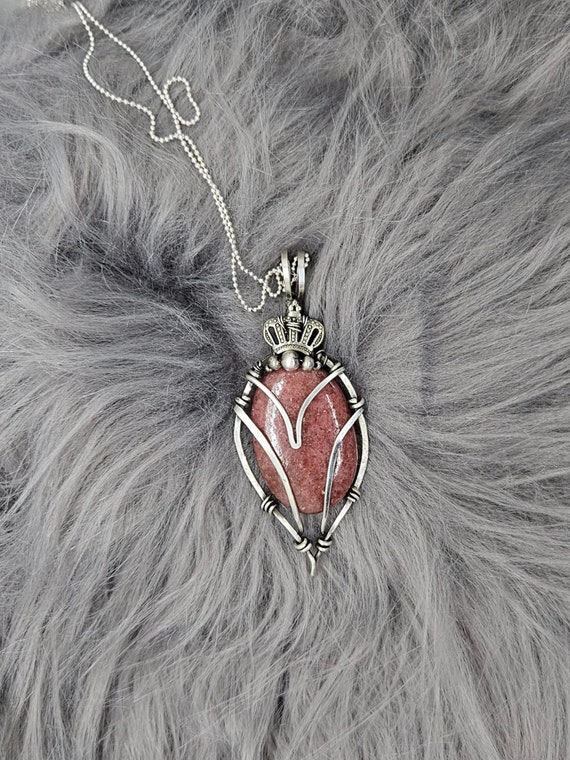 Queens. Restore self-love with Rhodochrosite in a sterling silver wire wrapped setting.