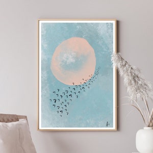 May include: A digital art print featuring a large, pale pink circle with a textured, watercolor-like effect, set against a light blue background. A flock of black birds flies in a curved line around the circle.