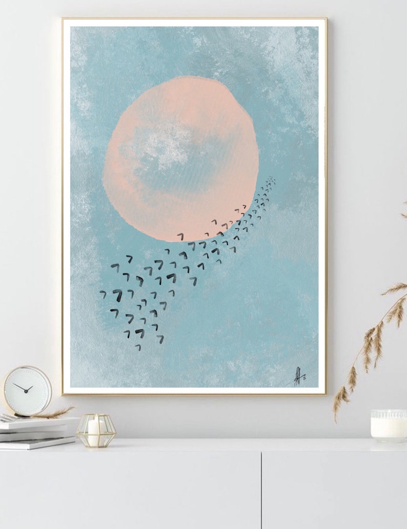 May include: Abstract art print with a large, pale pink circle in a light blue sky. A trail of black, stylized birds fly in a curved line towards the circle.