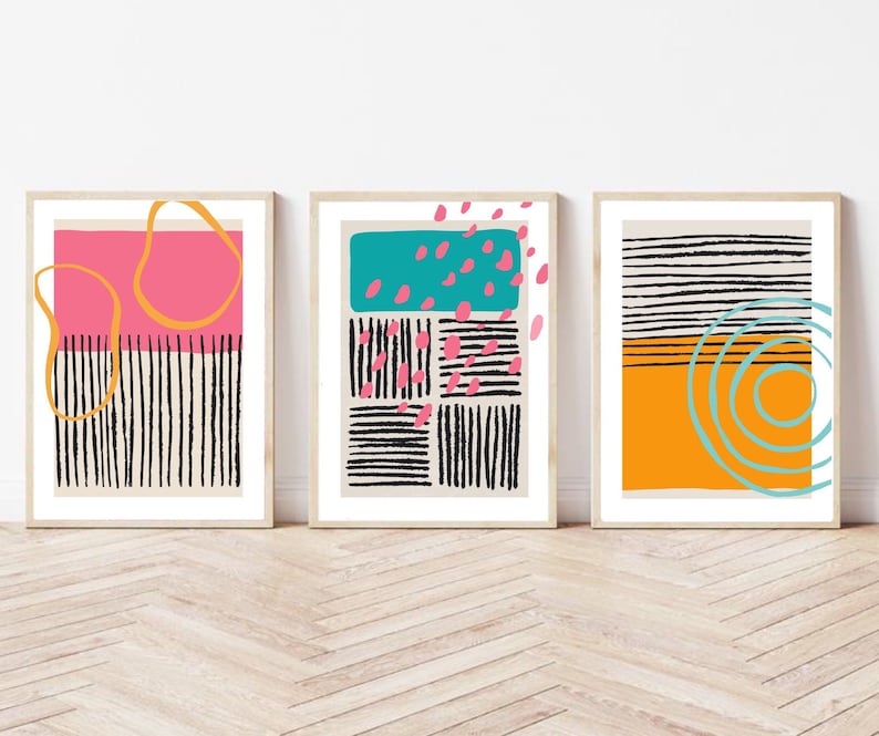 May include: Three abstract art prints with geometric shapes and patterns in black, white, pink, orange, yellow, and blue.