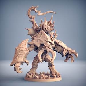 May include: A detailed miniature figure of a creature with a humanoid rider. The creature is a large, crab-like being with sharp claws and a segmented body. The rider is a humanoid figure with a long, curved blade. The miniature is painted in a light brown colour.