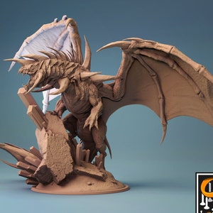 May include: A detailed, 3D printed miniature of a dragon with a spiky back and large wings, standing on a rocky base with crystals. The dragon is painted in a light brown color.