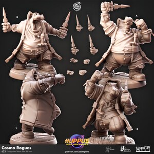 May include: A 3D printed miniature of a humanoid figure with a hippopotamus head, wearing a hooded coat and holding a dagger. The figure is posed in a fighting stance. The miniature is designed for tabletop role-playing games.