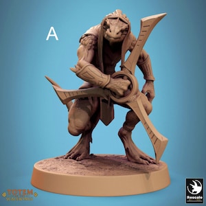 May include: A detailed figurine of a reptilian humanoid creature in a crouching pose, holding a large, stylized weapon. The figure is a light brown color and stands on a circular base. The word "A" is visible in the upper left corner.