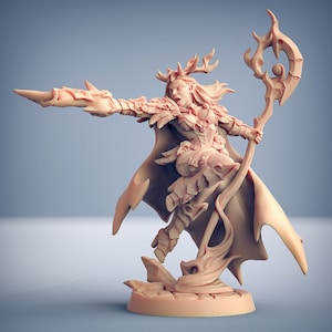 May include: A miniature figurine of a female elf with antlers, wearing a feathered cloak and holding a staff with a swirling design. The figurine is painted in a light pink color and is standing on a circular base.