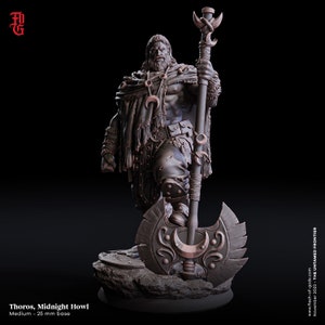May include: A detailed miniature figurine of a warrior with a long beard, wearing a cloak and holding a large axe and a staff. The figurine is painted in shades of brown and grey, with copper accents. The base of the figurine is a rocky outcrop.
