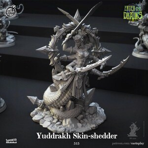 May include: A grey resin miniature figure titled Yuddrakh Skin-shedder, featuring a multi-armed humanoid torso with a serpentine tail base. The figure holds multiple curved blades and stands before a large, ornate, spiked circular frame.