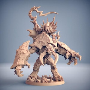 May include: A light brown unpainted resin miniature figure depicting a creature with a large, armoured, crab-like body and a humanoid rider with tentacles on its face. The rider holds a curved, lightning-shaped weapon above its head.