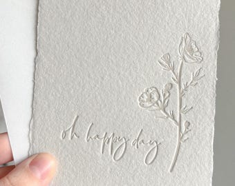 Tarjeta de felicitación con impresión tipográfica floral: papel de lana hecho a mano