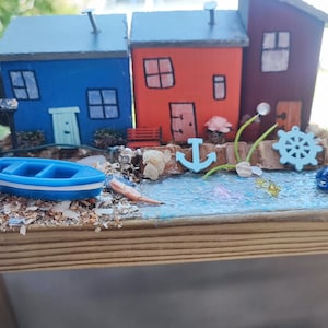 miniature coastal village.&quot;Handmade seaside village with colorful cottages, boat & nautical details – perfect coastal decor or beach lover .