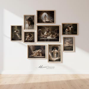 May include: A collection of nine framed art prints depicting scenes from the life of Jesus. The artwork features warm tones and detailed depictions of biblical events, including the Last Supper and the crucifixion. The frames are a light wood color, and the prints are arranged on a white wall.