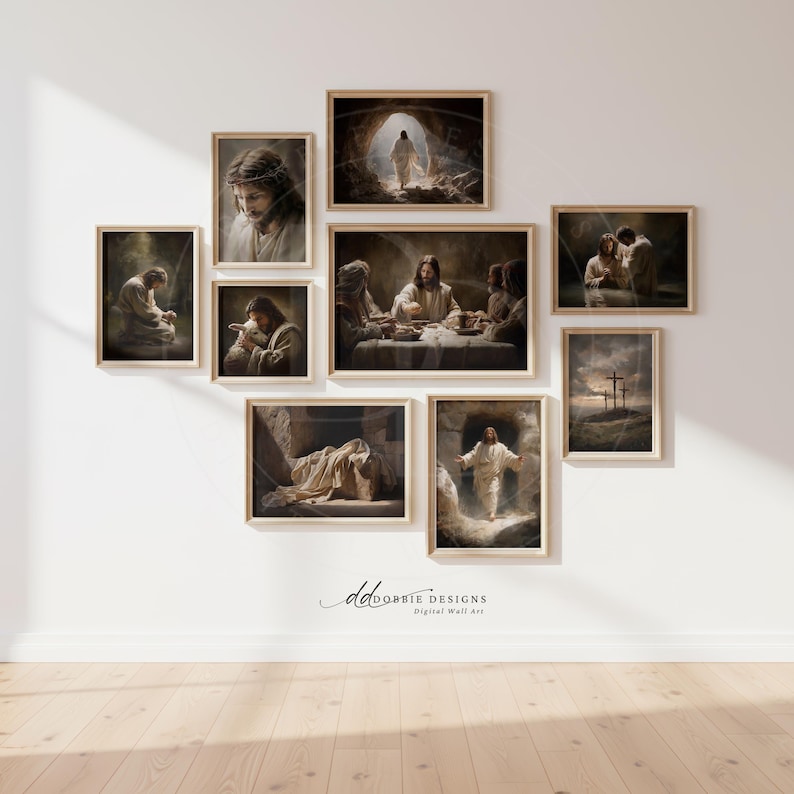 May include: A collection of nine framed art prints depicting scenes from the life of Jesus. The artwork features warm tones and detailed depictions of biblical events, including the Last Supper and the crucifixion. The frames are a light wood color, and the prints are arranged on a white wall.