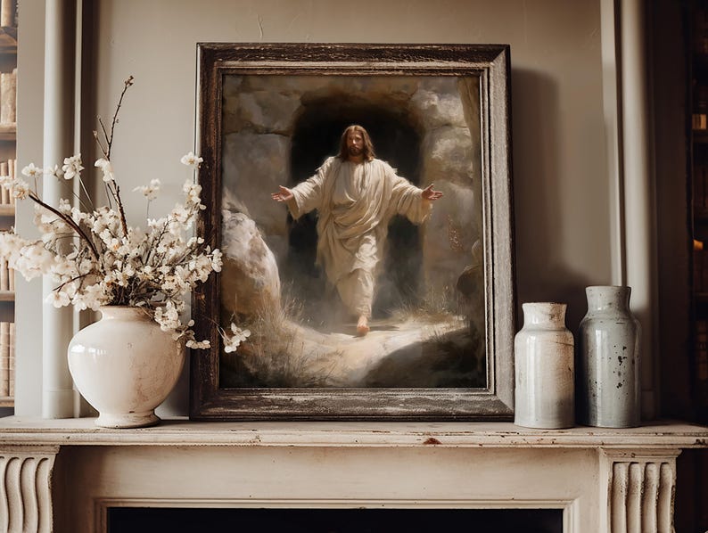 May include: A framed religious painting depicts a figure in white robes emerging from a cave, arms outstretched. The painting is set on a white mantelpiece, accompanied by a white vase with floral branches and two ceramic jars.