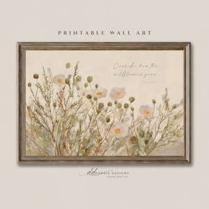 Peut inclure: Une impression d'art mural encadrée représentant une peinture aux tons doux de fleurs sauvages dans des nuances de crème, beige et vert sourd. Le texte "Consider how the wildflowers grow. Luke 12:27" est écrit en écriture fine au-dessus.