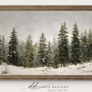 May include: A framed landscape painting depicts a snow-covered forest with tall evergreen trees. The artwork features a muted color palette of greens, grays, and whites, creating a serene winter scene. The frame is a warm, neutral tone.