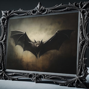 May include: A black and white framed print of a bat with its wings spread wide, flying against a dark, textured background.
