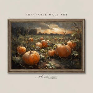 May include: A framed printable wall art piece featuring a landscape painting of a pumpkin patch at sunset. The scene displays multiple orange pumpkins resting on dark soil among tangled vines under a cloudy, golden-hued sky. Text reads PRINTABLE WALL ART and dd DOBBIE DESIGNS Digital Wall Art.
