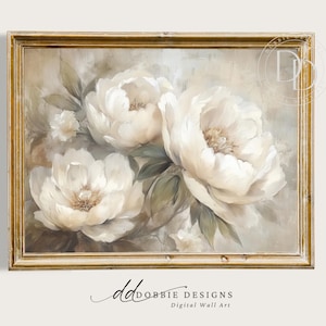 Puede incluir: Pintura enmarcada de flores de peonías blancas con centros cremosos y hojas verdes. La obra de arte está sobre un fondo apagado y está enmarcada en un marco dorado y ornamentado. El texto "DOBBIE DESIGNS Digital Wall Art" está en la parte inferior de la imagen.