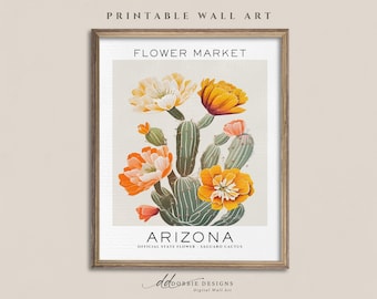Może przedstawiać: Oprawiony wydruk ścienny z botaniczną ilustracją zielonego kaktusa saguaro z żywymi pomarańczowymi i białymi kwiatami. Tekst brzmi FLOWER MARKET na górze oraz ARIZONA OFFICIAL STATE FLOWER - SAGUARO CACTUS na dole.