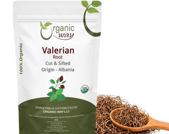 May include: A white stand-up pouch labeled Organic Way Valerian Root Cut & Sifted Origin - Albania with a green leaf graphic and USDA Organic seal. A wooden spoon filled with brown dried root pieces sits next to the pouch.