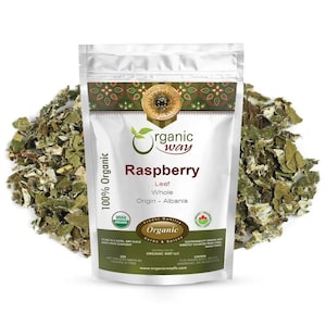 May include: A white bag of Organic Way Raspberry Leaf Whole from Albania, surrounded by dried leaves. The bag features the text "100% Organic", "Raspberry", and "Organic Way" with USDA and other logos.