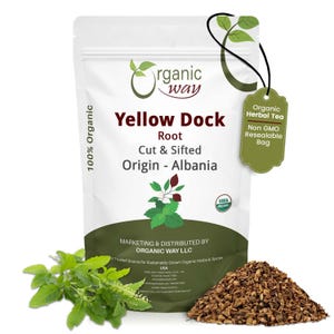 May include: A white resealable bag of "Yellow Dock Root" with a green tag that reads "Organic Herbal Tea". The bag also has the text "Cut & Sifted Origin - Albania". A pile of brown root and green herbs are in front.