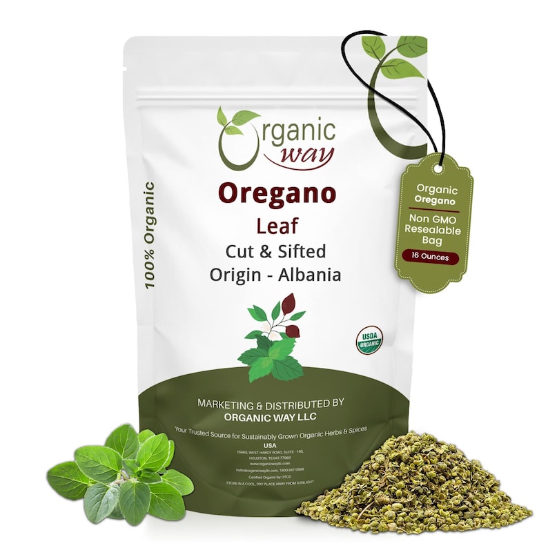 May include: A white resealable pouch of Organic Way Oregano Leaf, cut and sifted, originating from Albania. The label states 100% Organic, 16 Ounces, and Non GMO. A pile of dried oregano and a sprig of fresh green oregano leaves are displayed in front.