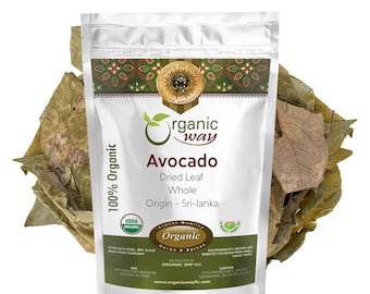 May include: A white resealable pouch with a silver foil exterior. The pouch contains dried avocado leaves. The front of the pouch has a label with the text "organic way" in a green circle, "Avocado" in a large font, "Dried Leaf Whole" in a smaller font, and "Origin - Sri-lanka" in a smaller font. The label also includes a USDA Organic seal and a "Finest Quality Organic Herbs & Spices" seal.