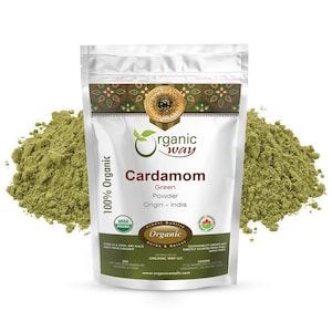 May include: A resealable pouch of 100% organic green cardamom powder. The pouch is white with green and gold accents. The text on the pouch reads "Organic Way Cardamom Green Powder Origin - India".