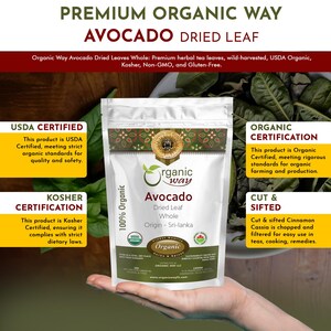 May include: A brown paper bag with a white label that says "Organic Way Avocado Dried Leaf Whole" and "Origin - Sri-lanka". The bag is sitting on a hand. The bag is surrounded by green avocado leaves.