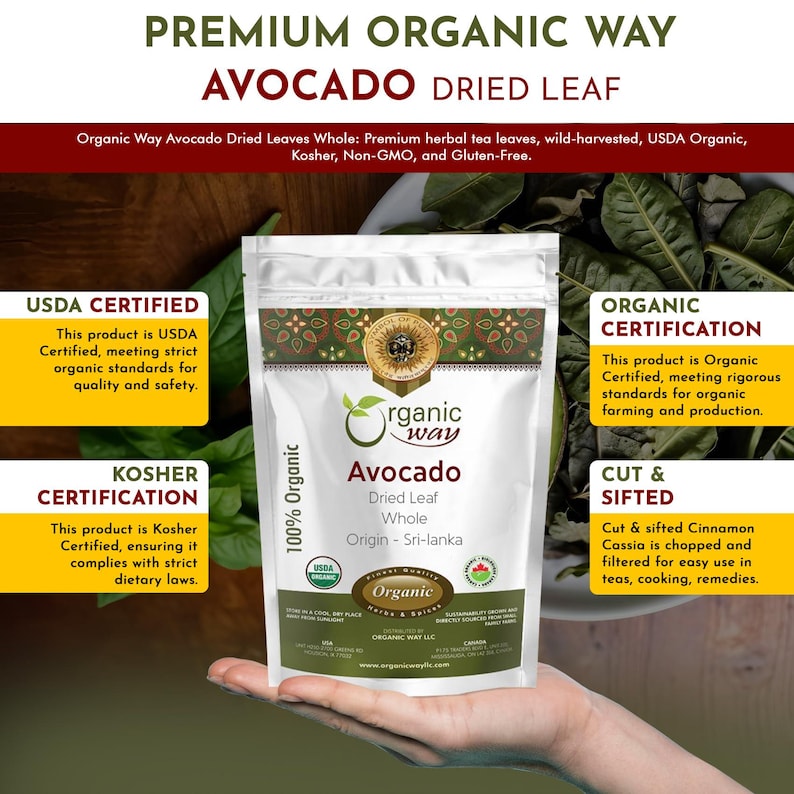 May include: A brown paper bag with a white label that says "Organic Way Avocado Dried Leaf Whole" and "Origin - Sri-lanka". The bag is sitting on a hand. The bag is surrounded by green avocado leaves.