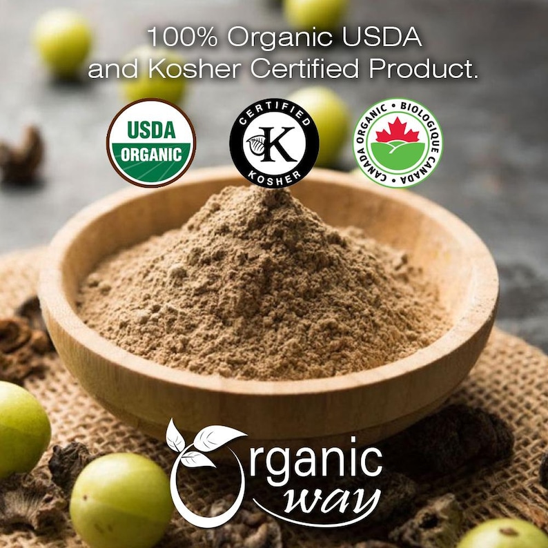 May include: A wooden bowl filled with brown powder, likely a food product, sits in the center of the image. The text reads "100% Organic USDA and Kosher Certified Product." USDA Organic, Kosher, and Canadian Organic logos are also visible. The "Organic Way" logo is at the bottom.