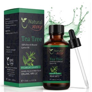 May include: A brown glass bottle of Natural Way Tea Tree oil with a black cap and dropper. The label reads "100% Pure & Natural Carrier Oil." A green box with the same branding is to the left. The bottle contains 1 fl oz.