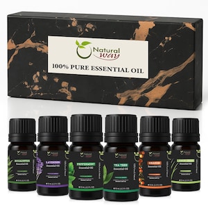 May include: A collection of six essential oil bottles with black lids, presented in front of a black box with gold marbling. The bottles are labelled with the oil names: Eucalyptus, Lavender, Peppermint, Tea Tree, Orange, and Lemongrass. Each bottle contains 10 ml.