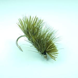 May include: A green and brown fly fishing lure with a gold hook.