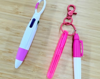 Complemento: Set de marcadores fluorescentes rosas y bolígrafos multicolor