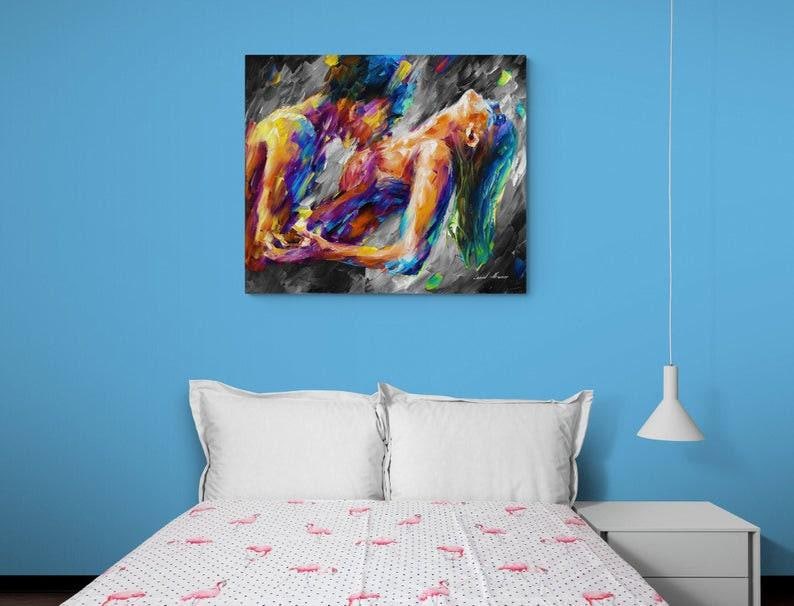 May include: Abstract art print depicting two figures in a passionate embrace. The artwork features a vibrant palette of blues, yellows, and purples against a dark, textured background. The figures are rendered with bold brushstrokes.