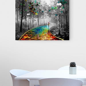 May include: A colorful oil painting depicts a path through a forest. The path is a vibrant rainbow of colors, with a person walking under an umbrella. The trees are in grayscale with touches of green and blue.
