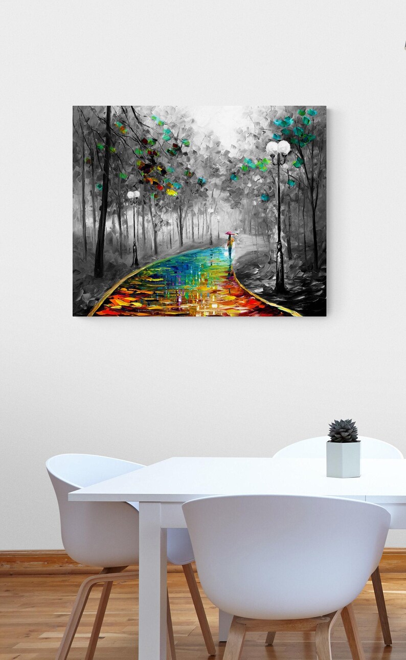 May include: A colorful oil painting depicts a path through a forest. The path is a vibrant rainbow of colors, with a person walking under an umbrella. The trees are in grayscale with touches of green and blue.