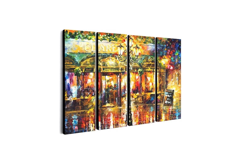 May include: A four-panel canvas print depicting a vibrant, impressionistic street scene. The artwork features a cafe with the name "CLAIRE" above the entrance, illuminated by warm lighting. The color palette includes rich oranges, yellows, and blues, creating a lively atmosphere.