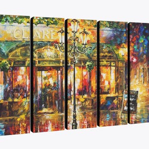 May include: A five-panel canvas print of an impressionistic street scene. The artwork depicts a cafe with the name "CLARE" above the entrance, illuminated by warm, inviting lights. A vintage lamppost stands in front of the cafe, adding to the ambiance.