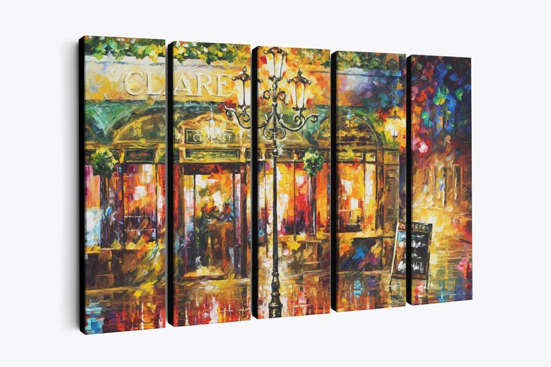 May include: A five-panel canvas print of an impressionistic street scene. The artwork depicts a cafe with the name "CLARE" above the entrance, illuminated by warm, inviting lights. A vintage lamppost stands in front of the cafe, adding to the ambiance.