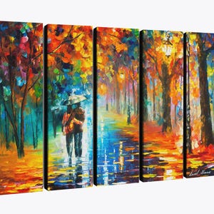 May include: A five-panel canvas art piece depicting a colorful autumn scene. The artwork shows a couple walking under an umbrella on a wet path, surrounded by trees with vibrant orange, yellow, and red leaves. The style is impressionistic.