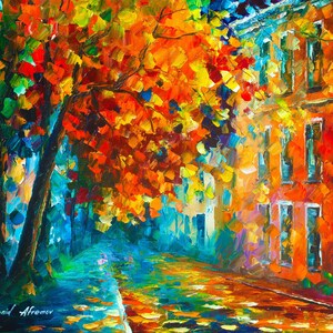 May include: An impressionistic oil painting of a city street in autumn. The artwork features vibrant colors, with orange and red leaves on the trees, a brick building, and a wet street reflecting the light. The artist's signature "Leonid Afremov" is in the bottom left corner.