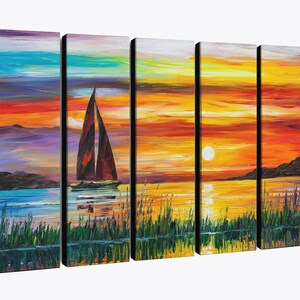 May include: A five-panel canvas art piece depicting a sunset over water. The artwork features a sailboat with brown sails, a vibrant orange and yellow sky, and a reflection of the scene in the water. Green reeds are in the foreground.