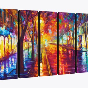May include: A five-panel canvas art piece depicting a vibrant, impressionistic street scene. The artwork features a colorful, wet street reflecting the lights of buildings and trees, with a palette of blues, yellows, and reds.