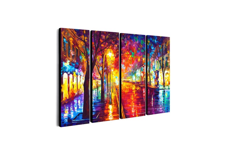 May include: A vibrant, multi-panel canvas print depicting a colorful street scene at night. The artwork features a street lined with trees and illuminated by streetlights, with reflections in the wet pavement. The color palette includes blues, oranges, and yellows.