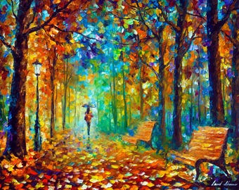 May include: An impressionistic painting of a park scene in autumn. A person with an umbrella walks along a path lined with trees and benches. The artwork features vibrant colors of orange, yellow, blue, and green, with a signature in the bottom right corner.