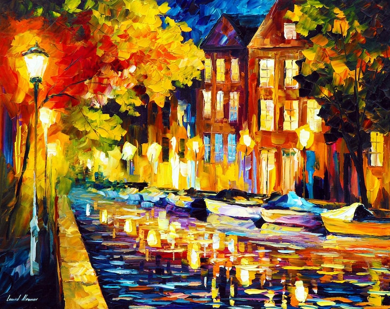 May include: An impressionistic painting of a European canal at night. The artwork features a row of buildings with lit windows, a lamplit walkway, and boats on the water. The color palette includes warm yellows, oranges, and reds, contrasted with cool blues and purples.